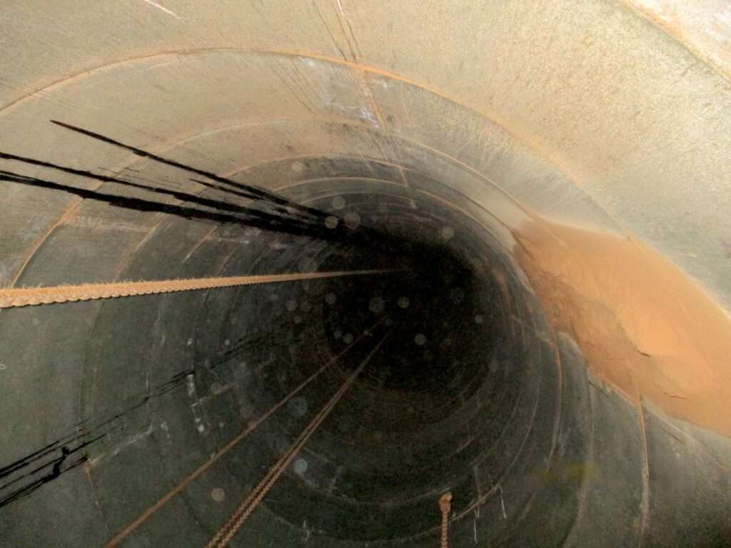 View down a completed fibre tube installation post fill.
